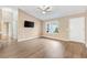 Inviting living room with a vaulted ceiling, a front door and large window with exterior view at 428 Tarrson Blvd, Lady Lake, FL 32159