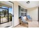 Inviting screened patio featuring comfortable seating, creating an ideal spot for relaxation and outdoor enjoyment at 428 Tarrson Blvd, Lady Lake, FL 32159