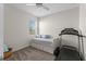 Cozy bedroom features a daybed with storage and natural light from the window at 4599 Storytelling Way, Kissimmee, FL 34746