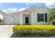 Inviting one-story home showcasing a well-kept lawn, front-entry two-car garage, and a decorative wreath on the front door at 4599 Storytelling Way, Kissimmee, FL 34746
