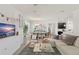 Bright and spacious living area flows into dining and kitchen, perfect for entertaining at 4599 Storytelling Way, Kissimmee, FL 34746