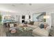 Spacious living room seamlessly connects to the dining area, showcasing modern decor and ample space at 4599 Storytelling Way, Kissimmee, FL 34746