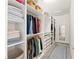 Spacious walk-in closet with custom shelving, providing ample storage and organization options at 4599 Storytelling Way, Kissimmee, FL 34746