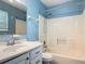 Bathroom with a vanity, mirror, and a shower-tub combination at 499 W Beresford Rd, Deland, FL 32720