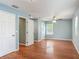 Large bedroom features hard wood floors, ceiling fan, and 3 different entry points at 499 W Beresford Rd, Deland, FL 32720