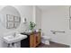 Powder room featuring a sink, a wooden vanity, and natural decor at 5075 Marshelder, Apopka, FL 32712