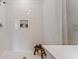 Modern bathroom with a tiled shower, built-in niche, a small bench, and neutral tones at 5075 Marshelder, Apopka, FL 32712