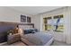 Charming bedroom featuring a striped bedspread, and a large window with a view at 5075 Marshelder, Apopka, FL 32712