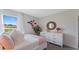 Bright bedroom featuring a decorative dresser and a large window with a view at 5075 Marshelder, Apopka, FL 32712