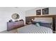Comfortable bedroom with a decorative dresser, sports themed decorations, and natural light at 5075 Marshelder, Apopka, FL 32712