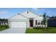 Charming single-story home with a well-manicured lawn and a two-car garage in a suburban neighborhood at 5075 Marshelder, Apopka, FL 32712