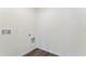 This laundry room has wood-look floors and convenient hookups for a washer and dryer at 5075 Marshelder, Apopka, FL 32712