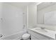 Clean, white bathroom features a shower-tub combination and single sink vanity at 5210 Marshelder, Apopka, FL 32712