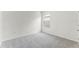 Carpeted bedroom with neutral walls and a window, with good natural light at 5210 Marshelder, Apopka, FL 32712