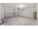 Spacious garage featuring an automatic door opener, water heater, and ample room for parking and storage at 5210 Marshelder, Apopka, FL 32712