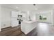 Modern kitchen featuring stainless steel appliances, white cabinetry and a center island at 5210 Marshelder, Apopka, FL 32712