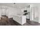 Bright kitchen with a large island, stainless steel appliances and an open floor plan at 5210 Marshelder, Apopka, FL 32712