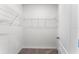 Efficient walk-in closet with sturdy wire shelving, ideal for organizing and storing clothing and accessories at 5210 Marshelder, Apopka, FL 32712