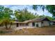 Exterior view of a home with a brick patio and lush greenery at 530 Webster St, Lake Mary, FL 32746
