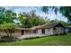 Spacious backyard featuring a brick patio, lush green grass, and well-maintained landscaping for outdoor enjoyment at 530 Webster St, Lake Mary, FL 32746