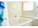Relax in this luxurious soaking tub with jets, complemented by marble accents and a bright window at 530 Webster St, Lake Mary, FL 32746