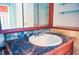 Bathroom featuring a single sink vanity with decorative tiles and ample storage at 530 Webster St, Lake Mary, FL 32746