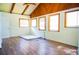 Bright bedroom features hardwood floors, white walls, and several windows for ample natural light at 530 Webster St, Lake Mary, FL 32746