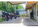 Covered outdoor carport with multiple motorcycles parked inside at 530 Webster St, Lake Mary, FL 32746