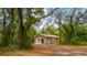 External shot of home surrounded by large trees at 530 Webster St, Lake Mary, FL 32746