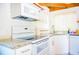 Bright kitchen with white appliances, granite countertops, and ample cabinet space at 530 Webster St, Lake Mary, FL 32746