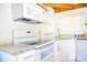 Bright kitchen with white cabinets, granite countertops, and modern appliances at 530 Webster St, Lake Mary, FL 32746