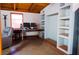 Comfortable living area features built-in shelving, wood ceilings, and modern workspace perfect for productivity at 530 Webster St, Lake Mary, FL 32746