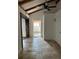 Open living room with wood beamed ceiling and neutral flooring with natural light at 530 Webster St, Lake Mary, FL 32746