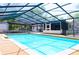 Sparkling pool with screened enclosure offering a private outdoor oasis for relaxation and entertainment at 530 Webster St, Lake Mary, FL 32746