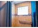 Tiled shower featuring a built-in seat and a glass block window for natural light at 530 Webster St, Lake Mary, FL 32746