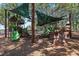 Community playground featuring slides and climbing structures with shade canopies at 611 Casa Park A Ct, Winter Springs, FL 32708