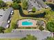 A birds eye view of the sparkling community pool, gazebo, pond, and parking at 611 Casa Park A Ct, Winter Springs, FL 32708