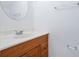 Bathroom featuring a vanity with a sink and a round mirror at 611 Casa Park A Ct, Winter Springs, FL 32708