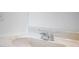 Clean bathroom features a chrome faucet set on a white sink and countertop at 611 Casa Park A Ct, Winter Springs, FL 32708