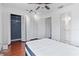 Bright bedroom with an open closet, ceiling fan, wood floors, and a view of the bathroom at 611 Casa Park A Ct, Winter Springs, FL 32708