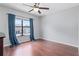 Bedroom with hardwood floors, a large window with curtains and ample natural light at 611 Casa Park A Ct, Winter Springs, FL 32708