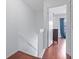 Upstairs hallway with hardwood floors leading to the bedrooms at 611 Casa Park A Ct, Winter Springs, FL 32708