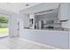Kitchen featuring granite countertops and stainless steel appliances overlooking the backyard at 611 Casa Park A Ct, Winter Springs, FL 32708
