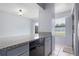Kitchen featuring granite countertops, a dishwasher, and natural lighting at 611 Casa Park A Ct, Winter Springs, FL 32708