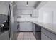 Kitchen featuring stainless steel appliances, granite countertops, and light gray cabinetry at 611 Casa Park A Ct, Winter Springs, FL 32708