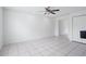 Spacious living room features tile floors, a ceiling fan, and natural light at 611 Casa Park A Ct, Winter Springs, FL 32708