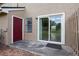 Enclosed patio with sliding door, red door, and private outdoor space at 611 Casa Park A Ct, Winter Springs, FL 32708