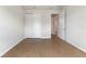 Neutral bedroom features closet space, light tile flooring, and a doorway with access to other rooms in the home at 6121 Blue Pond Way, St Cloud, FL 34771