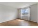 Spacious bedroom offers a large window with scenic views of a lake, tile flooring, and plenty of natural light at 6121 Blue Pond Way, St Cloud, FL 34771