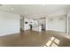 Spacious living area showcasing an open floor plan connecting the kitchen, dining, and living spaces at 6121 Blue Pond Way, St Cloud, FL 34771